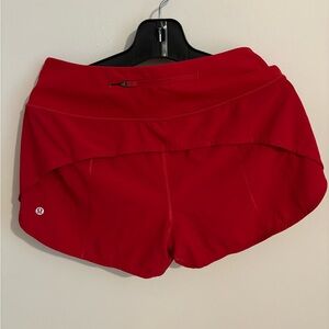 Red running shorts size 8
